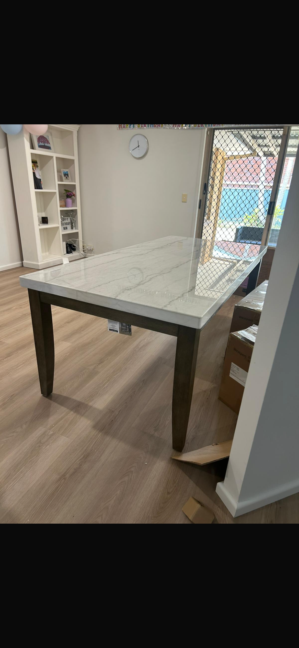 White glove delivery — dining table placed in customer home Brisbane by Bring Me Solutions